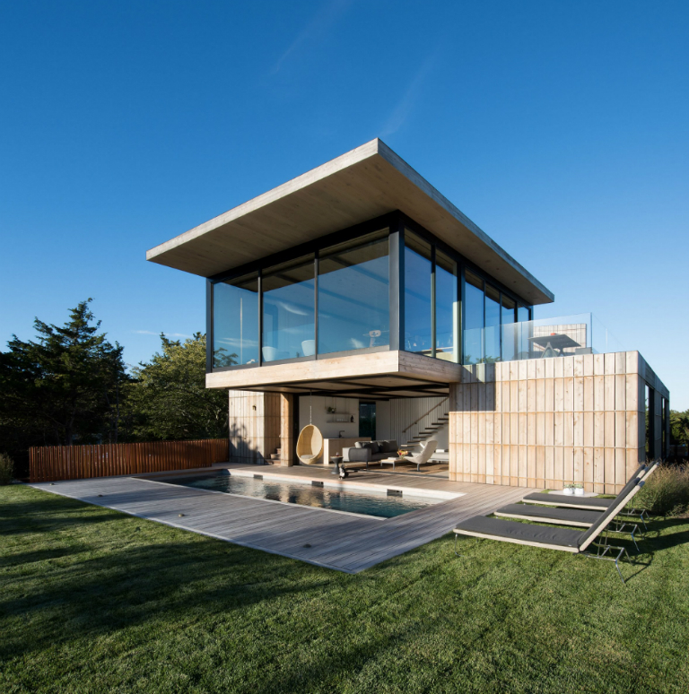 1-1 Hamptons home by Bates Masi features cantilevering upper floor
