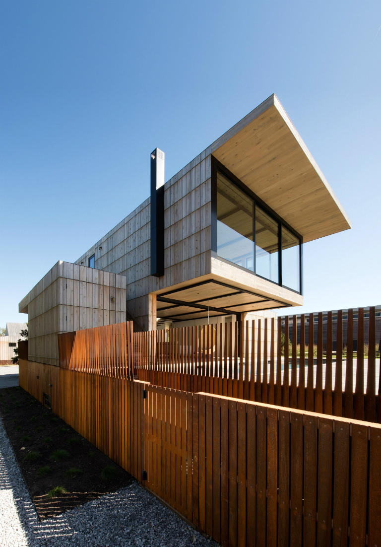 1-2 Hamptons home by Bates Masi features cantilevering upper floor