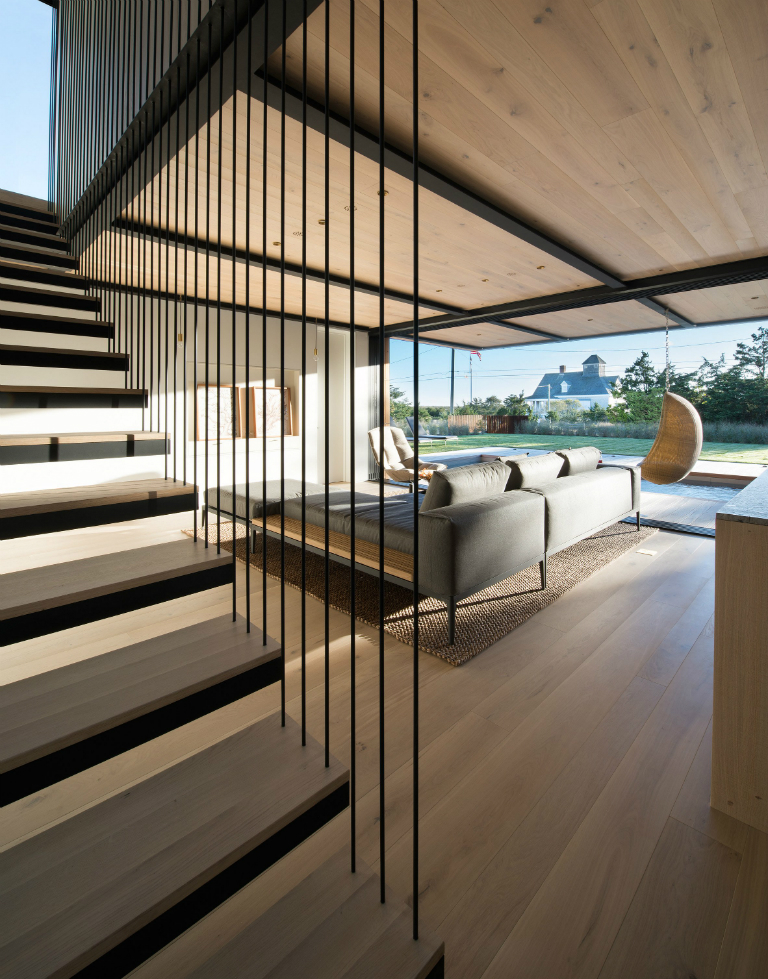 1-5 Hamptons home by Bates Masi features cantilevering upper floor